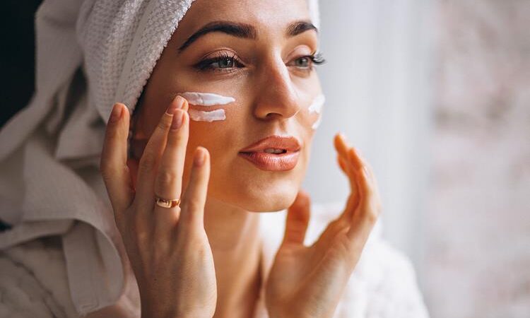 woman-applying-face-cream